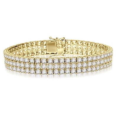 A majestic looking 7 inch Bracelet with 3 rows of brilliant masterpieces. Appx. 16 Cts. T.W. set in 14K Solid Yellow Gold.