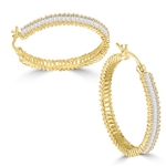 Diamond Essence Hoop earrings, covered with rich gleam of baguettes set in 14K Solid Gold. 11cts.t.w., 1 1/4" diameter.