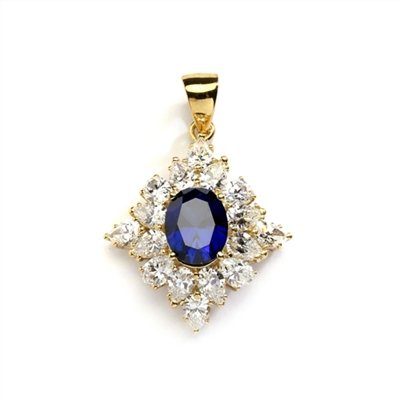 Designer pendant with 3.5 Ct. oval Sapphire Essence set in four prongs, and surrounded by pear cut diamond essence stones in floral pattern. 8.5 Cts. T.W. et in 14K Solid Yellow Gold.