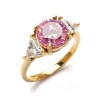 Risque- Diamond Essence Ring with 2 Carat Round Cut Pink Essence in Center and 0.5 Ct. Each trilliant cut side accents.3.0 Cts. T.W. set in 14K Solid Yellow Gold.