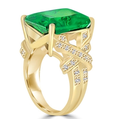 Diamond Essence emerald-cut Emerald stone of 11.00 carat set in a raised setting of 14K Solid Gold, with a stylish twist of small stones on shank. 11.75 cts.t.w.