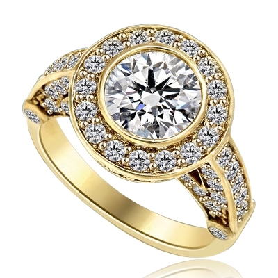 Designer Ring with Bezel Set, 2.0 Cts. Round Brilliant Diamond Essence in center with Melee around and on the band, 2.5 Cts. T.W. set in 14K Yellow Gold.