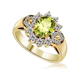 Floral Ring - 1.25 Cts. Oval cut Peridot Essence set in center with Round brilliant Diamond Essence on top and bottom and cluster of Melee, making floral design, on either side of band. 2.0 Cts. T.W. set in 14K Solid Yellow Gold.