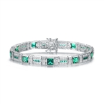 A stunner, this Platinum Plated Sterling Silver 7.25" bracelet features nine princess emerald stones, 0.25 cts each, joined by melee. 17.0 cts. T.W.