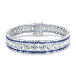 A stunner, this Platinum Plated Sterling Silver 7.25" bracelet features graduating round brilliant stones, sapphire baguettes at the top and the bottom. 30.0 cts. t.w.