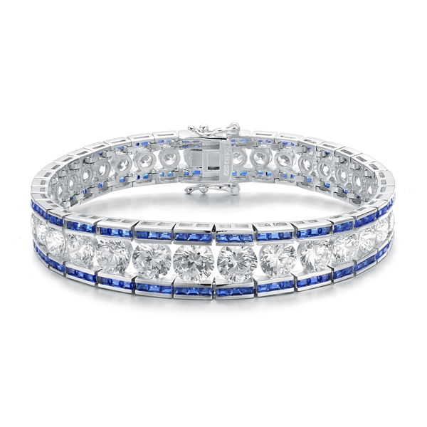 A stunner, this Platinum Plated Sterling Silver 7.25" bracelet features graduating round brilliant stones, sapphire baguettes at the top and the bottom. 30.0 cts. t.w.