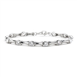7 Inches Bamboo Bracelet with 14 Diamond Essence Masterpieces Glittering in unique prong and link setting. 3.50 Cts. T.W. Match it with the Bambooty Necklace.