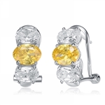 Diamond Essence Designer Earrings with Oval cut Canary Essence in center accompanied by Oval cut Diamond Essence on each side set in Platinum Plated Sterling Silver.