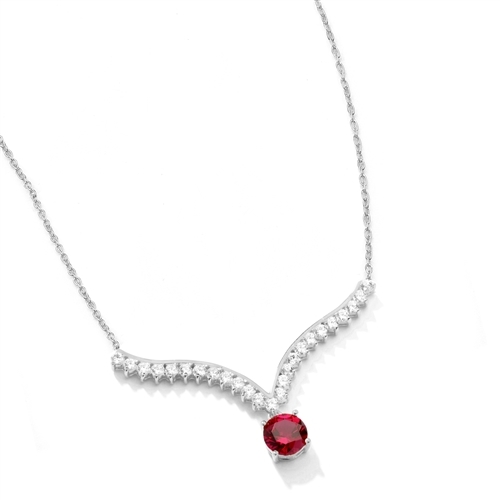 Supreme Necklace that is sure shot eye candy! 2.0 Cts. Round cut Ruby Essence Dangler atones a curvy melee of Round Brilliants set exquisitely in an Art Deco Setting! 3.50 Cts.T.W. attached with Chain in Platinum Plated Sterling Silver.