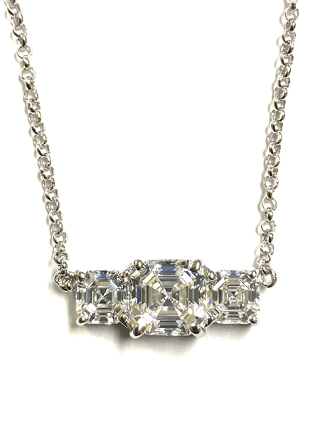 Beautiful Trio Necklace with Diamond Essence Asscher cut Stones set in four prongs,Platinum Plated Sterling Silver, 3.5 cts.t.w. 2 carat in the center and 0.75 ct. on each side.