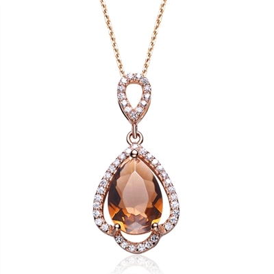 Diamond Essence Smoky Quartz 5 carat stone set in prong settings. Artistically surrounded by Diamond essence melee set in Rose plated Sterling Silver. 5.25 cts.t.w. Chain not included.