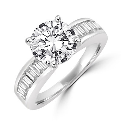 Diamond Essence Ring with 2.0 ct. Round Diamond Essence center with channel set baguettes on each side,2.5 ct. tw.in Platinum Plated Sterling Silver.