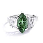 Erin - 1.5 Cts. Marquise Cut Emerald Essence is shining bright in center, accompanied by 3 Baguettes on each side. In Platinum Plated Sterling Silver.