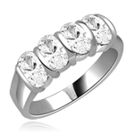 Mesmerizing Band that is artfully decorated with four matching Oval Cut Diamond Essence Masterpieces. 2 Cts. T.W, in Platinum Plated Sterling Silver.