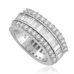 Private Pleasures - Wide Band Ring with a beautiful triple spin! Three heavenly rows of Diamond Essence Masterpieces. In the center, intimately touchinh channel set baguettes, and on both side round cut melee pieces. 5 Cts. T.W, in 14K Solid White Gold.