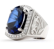 Tiger Imprinted with For the king of the jungle, this authoritative men’s ring has a deep-blue oval Sapphire Essence, 5.45 cts., in the center, flanked by Diamond Essence melee in 14K White Gold, with tigers imprinted in Gold on either side. 8.45 cts. t.w