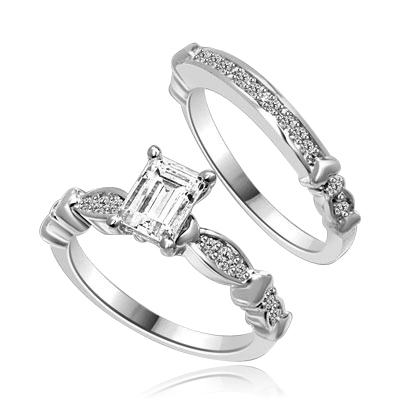 Beautiful Wedding Set with 1.0 Ct. Emerald cut Emerald Essence set in center accompanied by Melee on either side and on the matching band. 1.50 Cts. T.W. set in Platinum Plated Sterling Silver.