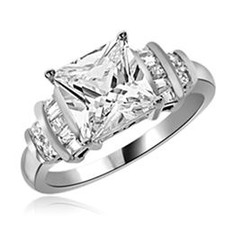 Diamond Essence Designer Ring With 3 Cts. Princess Cut Center Set in Four Prongs, Baguettes and Melee On Each Side,3.50Cts.T.W in Platinum Plated Sterling Silver.