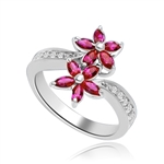 Dual Flowers - Curvy Band shines bright and Ruby Oval Flower Cluster sits pretty in this unique design. 2 Ct. T.W. In Platinum Plated Sterling Silver.