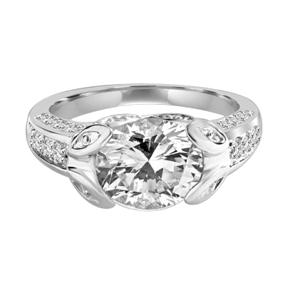 Designer Ring with 3.0 Cts. Round Brilliant Diamond Essence, artistically set in leaf shaped prongs in center, set off by Melee on either side of the band. 4.0 Cts. T.W. set in Platinum Plated Sterling Silver.