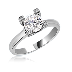 Solitaire Ring with 2.0 Cts. Round Brilliant Diamond Essence center set in stone studded wide prongs. Available in select Ring sizes.