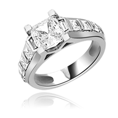 Brilliantly crafted Diamond Essence Princess cut masterpiece is flanked by graduating Princess cut stones on the band exquisitely set in channel setting boasting 3 Cts. T.W. In Platinum Plated Sterling Silver. Available in select Ring sizes.