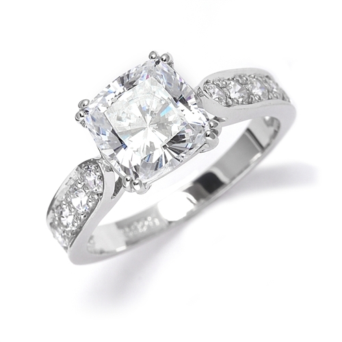 Diamond Essence Ring with 2.0ct. Cushion Cut stone set in eight prongs with round stones on each side, 3.5ct. tw. in Platinum Plated Sterling Silver.