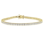 7" long Tennis Bracelet strung with 67 Princess Cut masterpieces in a mesmerizing array, with double safety clasp. 6.5 Cts. T.W. set in 14K Gold Vermeil.