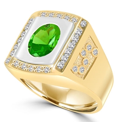 An impresive men's Ring in  two-toned 14K Gold Vermeil features a 4.0 cts. Oval Emerald  stone set flush in a platform of white gold surrounded by melee, with double jolts of melee on each shank. 4.50 cts. t.w.
