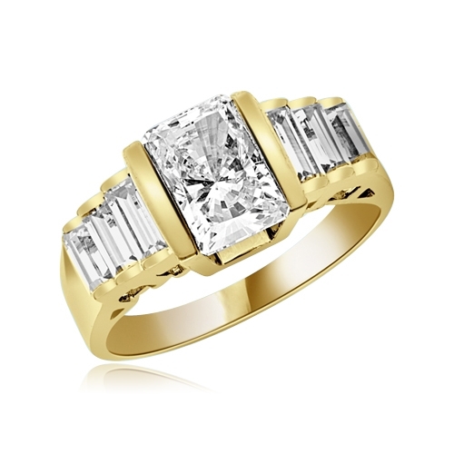 Great looking band with graduating baguettes on the band and 1.5 ct. radiant emerald Diamond Essence center, set in thick bar setting. 2.5 cts.t.w. in Gold Plated Sterling Silver.