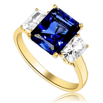 Sapphire Ring - 4.0 Cts. Radiant Emerald cut Saphhire Essence in center accompanied by Radiant Emerald cut Diamond Essence on sides. 5.0 Cts. T.W. set in 14K Gold Vermeil.