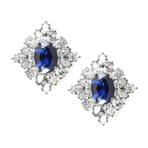 Designer Earrings with 3.5 ct. oval Sapphire Essence set in four prong, and surrounded by pear cut diamond essence stones in floral pattern. 8.5 cts. each earring. 17.00Cts. T.W. set in 14K Solid White Gold.