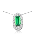 Emerald City Pendant with a 3.0 Cts. Emerald Cut Emerald Essence center surrounded by fiery Round Cut Diamond Essence Stones, 3.30 Cts. T.W. in 14K Solid White Gold.
Free Silver Chain Included.
