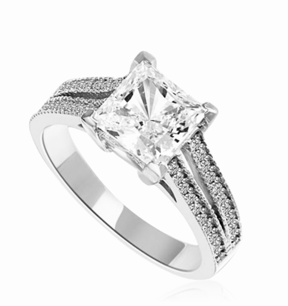 Diamond Essence Ring with Princess  in Center accompanied by two rows of melee on each side. 3.25 Cts T.W. set in 14K solid White Gold.