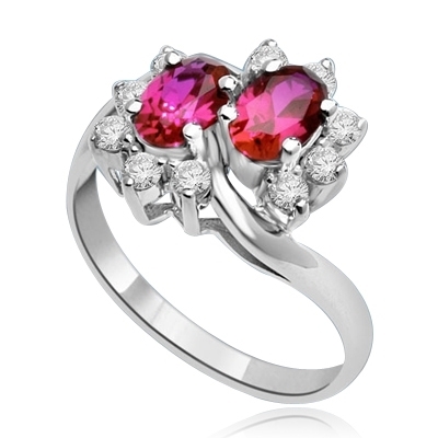 Two Ruby Oval Essence, 0.5 ct. each, set in four prongs and surrounded by melee to give floral effect. 1.20 cts. t.w. In 14k Solid White Gold.