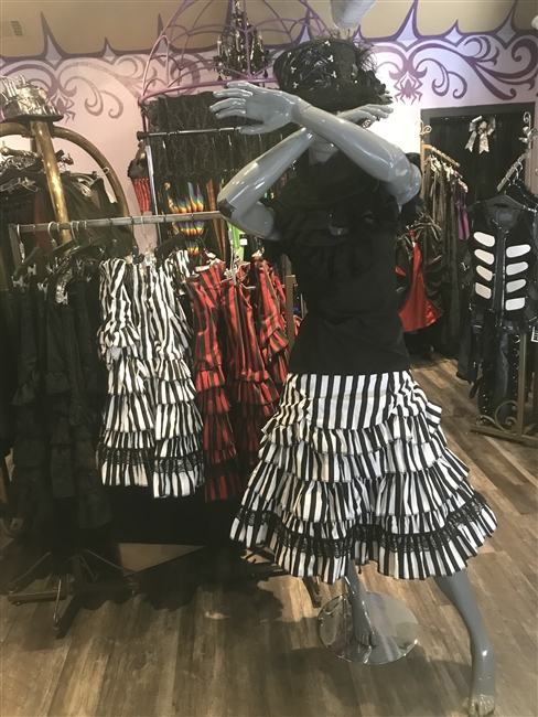 Erin Skirt is done in our Black and White Striped Fabric and features many Layered Ruffles and a Side Zipper. This Victorian-inspired Below the knee skirt is fully lined with a 100% Polyester Lining.