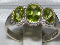 Elegant Sterling Silver Peridot Trilogy Ring