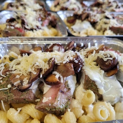 Rosemary roasted beef over gorgonzola cream pasta