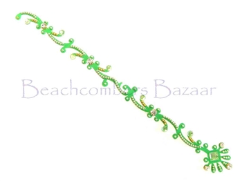 Parrot green with sparkling white crystals in a long tikka style bindi.