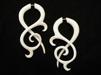Off white bone drop curls with a long tail are some of our most beautiful earrings.