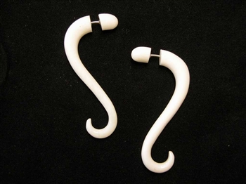 Two inch long fake gauges in a soft snake-like drop in bone.