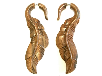 Wooden earrings carved in a long feather style.