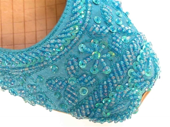 Bright turquoise cyan blue shoes with beads and sequins.
