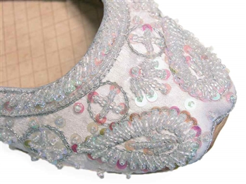 Wedding shoes in silvery white silk with iridescent beads and sequins.