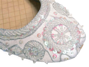 Wedding shoes in silvery white silk with iridescent beads and sequins.