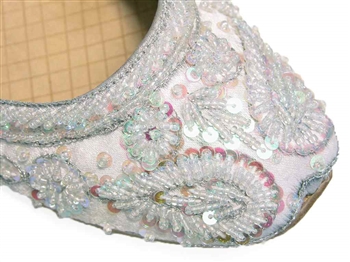 Wedding shoes in silvery white silk with iridescent beads and sequins.