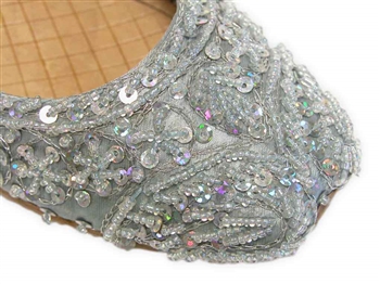 Light ice blue silk Indian khussa shoes are covered with silver beads and sequins for women.