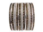 Sparkling silver metallic and glitter bangles accented with black bangles and gold glitter.