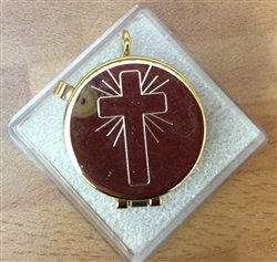 Gold pyx engraved with a cross design