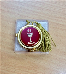 Gold pyx with red and gold chalice